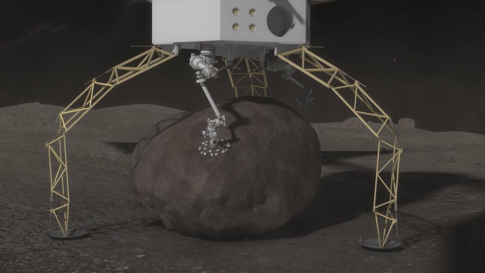 Ein computeranimiertes Bild der Nasa zeigt eine Raumfähre, die einen Stein von einem größeren Asteroiden transportieren will. Ein computeranimiertes Bild der Nasa zeigt eine Raumfähre, die einen Stein von einem größeren Asteroiden transportieren will.