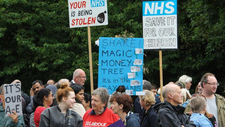 July 4, 2017 - Weston-Super-Mare, North Somerset, UK - Weston-super-Mare, North Somerset, UK. A protest against the overnight closure of Weston General Hospital Accident and Emergency department is held before the Weston Area Health NHS Trust  Board meeting at Weston General Hospital which is to agree the temporary overnight closure of the Accident & Emergency department because of staffing levels, with no projected date given for a return to 24hr service. It was announced last month the A&E unit would be closing between 10pm and 8am from Tuesday 04 July, after a Care Quality Commission inspection raised concerns over the long-term sustainability of staffing levels. The decision has been made on patient safety grounds because the trust cannot provide enough specialist hospital doctors to safely staff the A&E department overnight. Patients arriving by ambulance will instead be taken to either the BRI or Southmead in Bristol, or Taunton’s Musgrove Park hospitals, and anyone who would otherwise turn up to the A&E department themselves is being urged to either try to get to Bristol or ring the NHS helpline on 111. Unison, the trade union representing health workers, said it was vital the NHS bosses running Weston’s hospital had a plan in place to reinstate the 24 hour service as soon as possible, so the temporary closure didn’t become permanent. Unison says the closure comes from a staffing shortage that is the direct result of the government running down the NHS, and that on the week of the NHS' 69th birthday, they value this national treasure and the staff who keep it going more than ever. A hospital spokesman said they had no choice to close the unit after the CQC report rated the A&E department ‘inadequate’, and that A&E has been fragile for several years as a result of ongoing challenges around medical recruitment and a national shortage of A&E doctors which has made this position worse. They have become heavily reliant on locum and agency workers and ...
