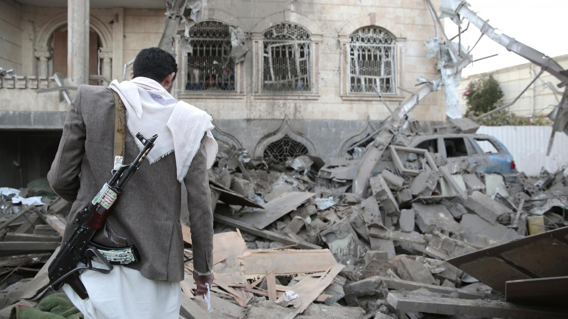 A man inspects the rubble of houses allegedly destroyed by Saudi-led air strikes in Sanaa, Yemen, 09 June 2017. A Saudi-led airstrike hit a house in Yemen's capital Sanaa, on Friday, killing four civilians, including women and children, and injuring a number of others, Yemen's local Saba news reported.
