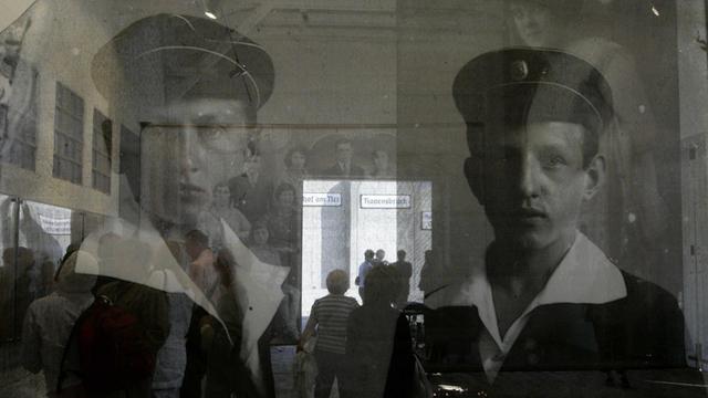 This picture taken 29 August 2004 shows transparent photos featuring Jewish citizens of Lodz, before the war, inside the Lodz ghetto's museum. The Polish city of Lodz on Sunday marked the 60th anniversary of the destruction by the Nazis of its World War II Jewish ghetto, paying homage to 200,000 who died and the few hundred who survived. AFP PHOTO JANEK SKARZYNSKI / AFP PHOTO / JANEK SKARZYNSKI
