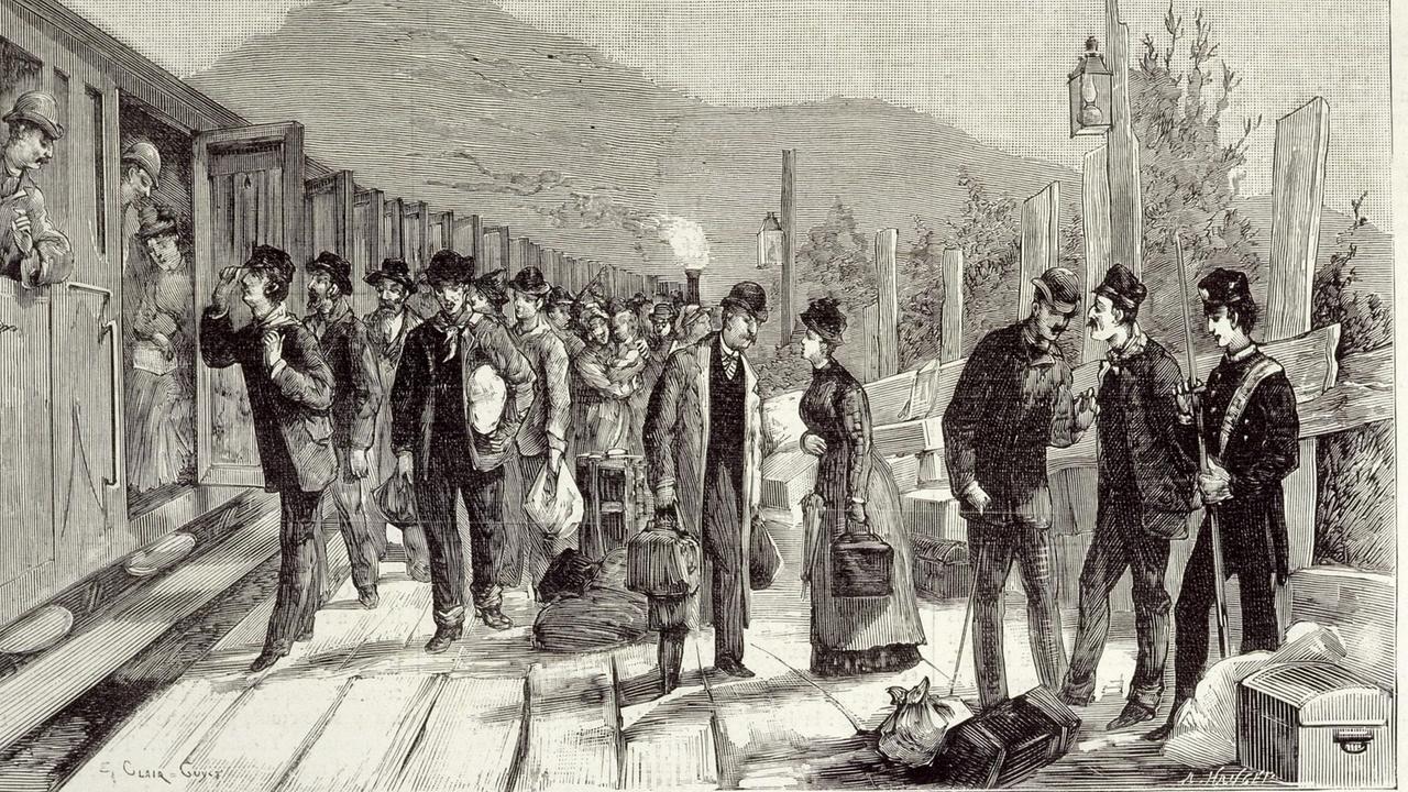 Gravurbild des Bahnhofs im italienischen Ventimiglia 1884. Reisende stehen neben einem Zug. Gravurbild des Bahnhofs im italienischen Ventimiglia 1884. Reisende stehen neben einem Zug.