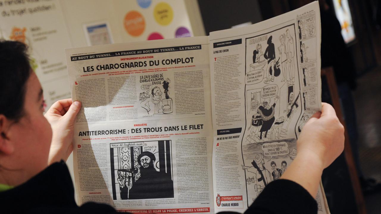 Ein Blick in die erste "Charlie-Hebdo"-Ausgabe nach dem Pariser Anschlag Ein Blick in die erste "Charlie-Hebdo"-Ausgabe nach dem Pariser Anschlag