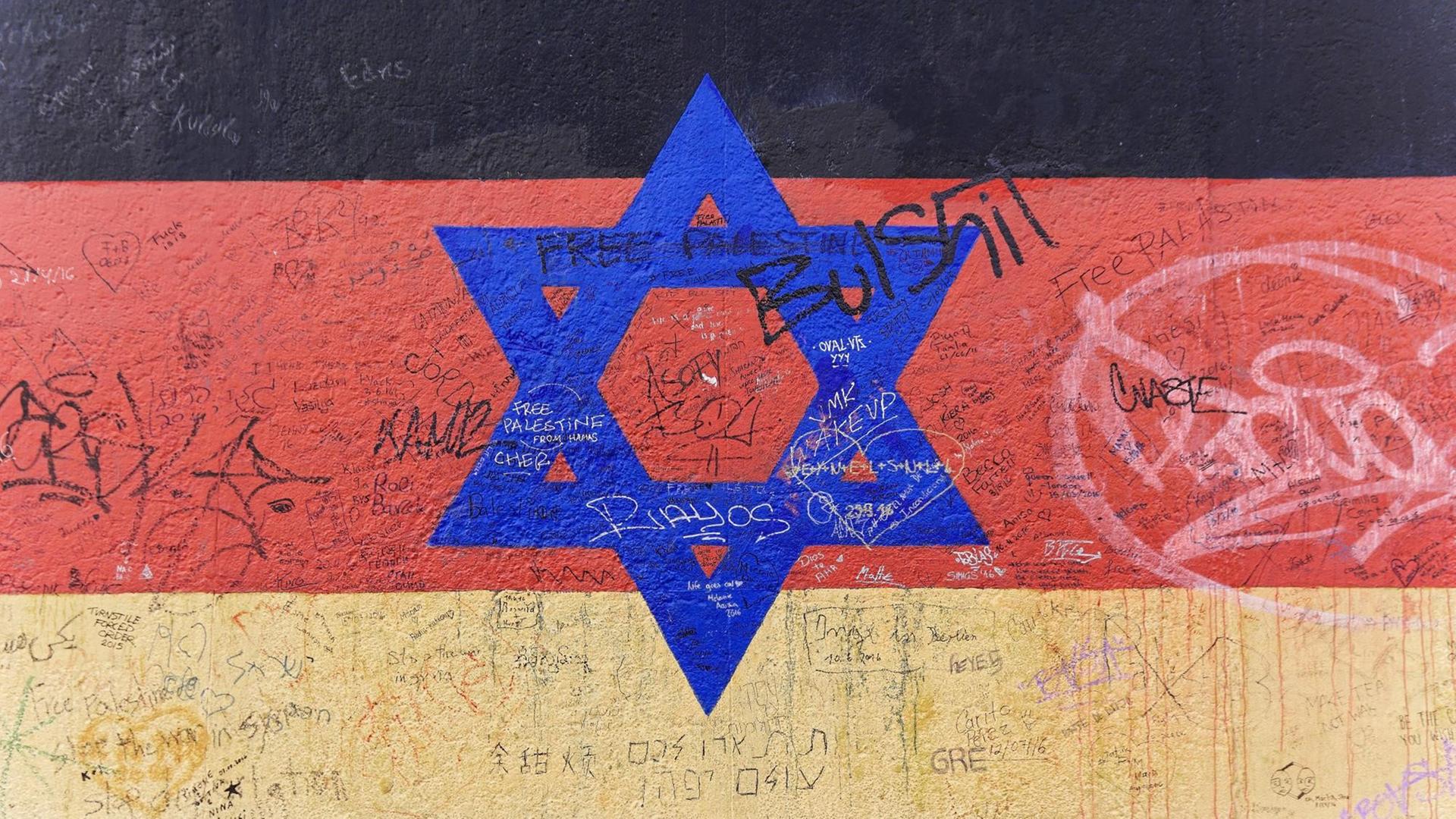 Wandgemälde einer deutsche Flagge mit Davidstern an der East Side Gallery in Berlin. Copyright: imageBROKER/EgonxBömsch Wandgemälde einer deutsche Flagge mit Davidstern an der East Side Gallery in Berlin. Copyright: imageBROKER/EgonxBömsch