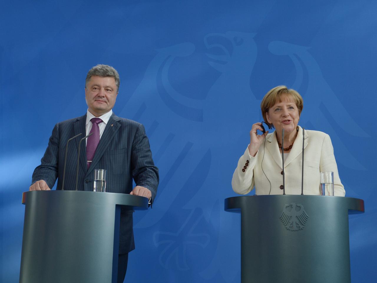 Bundeskanzlerin Angela Merkel und der ukrainische Präsident Petro Poroschenko: "Eine der wichtigsten Moderatorinnen" Bundeskanzlerin Angela Merkel und der ukrainische Präsident Petro Poroschenko: "Eine der wichtigsten Moderatorinnen"
