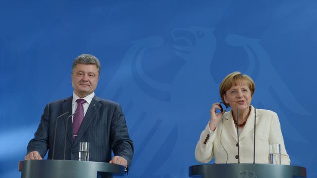 Bundeskanzlerin Angela Merkel und der künftige ukrainische Präsident Petro Poroschenko