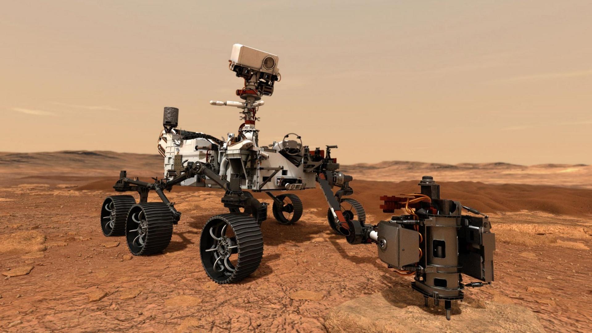 Der Mars-Rover "Perseverance" steht auf dem roten Gestein auf dem Planeten Mars. Er sieht aus wie eine Art Gelände-Wagen mit sechs Rädern. Der Mars-Rover "Perseverance" steht auf dem roten Gestein auf dem Planeten Mars. Er sieht aus wie eine Art Gelände-Wagen mit sechs Rädern.