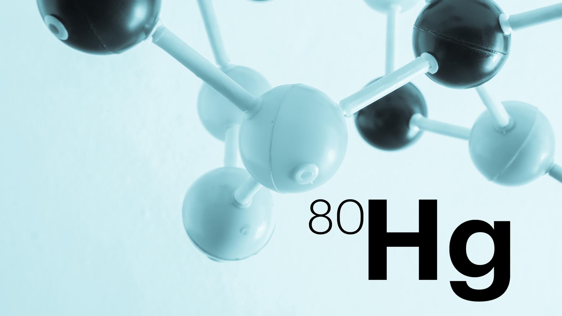 Das Modell eines Moleküls ist hinter der Abkürzung Hg (für Quecksilber) zu sehen. Das Modell eines Moleküls ist hinter der Abkürzung Hg (für Quecksilber) zu sehen.