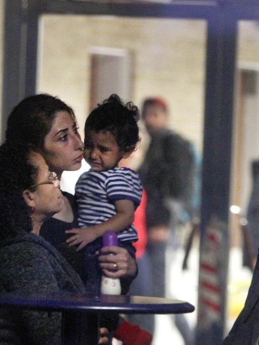 Syrische Flüchtlinge nach ihrer Ankunft in Rodby im Süden Dänemarks.