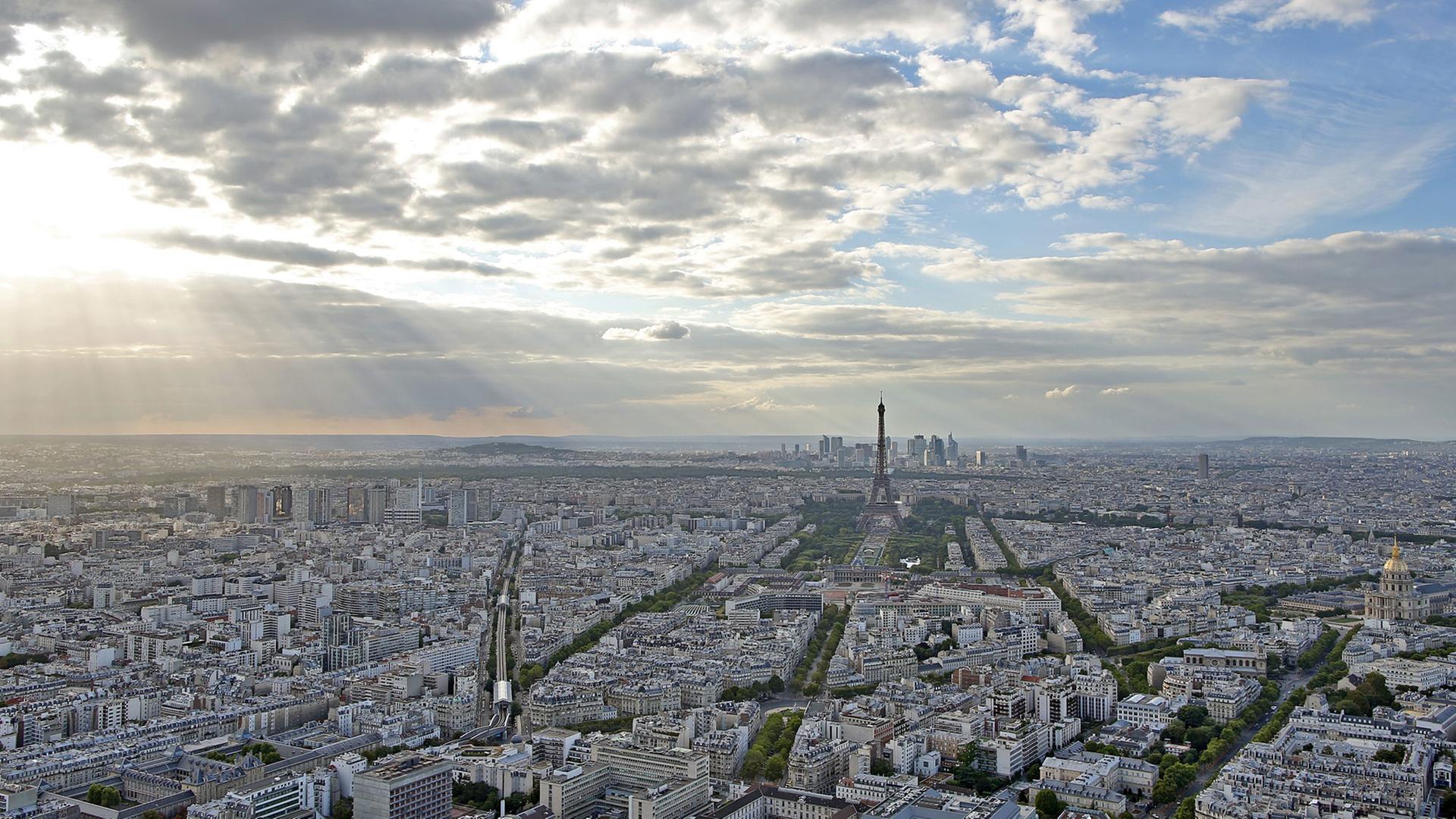 View of the center of Paris (France) 16.08.2015. In the middle you can see the Eiffel Tower, on the right you can see the Invalides. The photo was taken from the Tour Maine-Montparnasse skyscraper. View of the center of Paris (France) 16.08.2015. In the middle you can see the Eiffel Tower, on the right you can see the Invalides. The photo was taken from the Tour Maine-Montparnasse skyscraper.