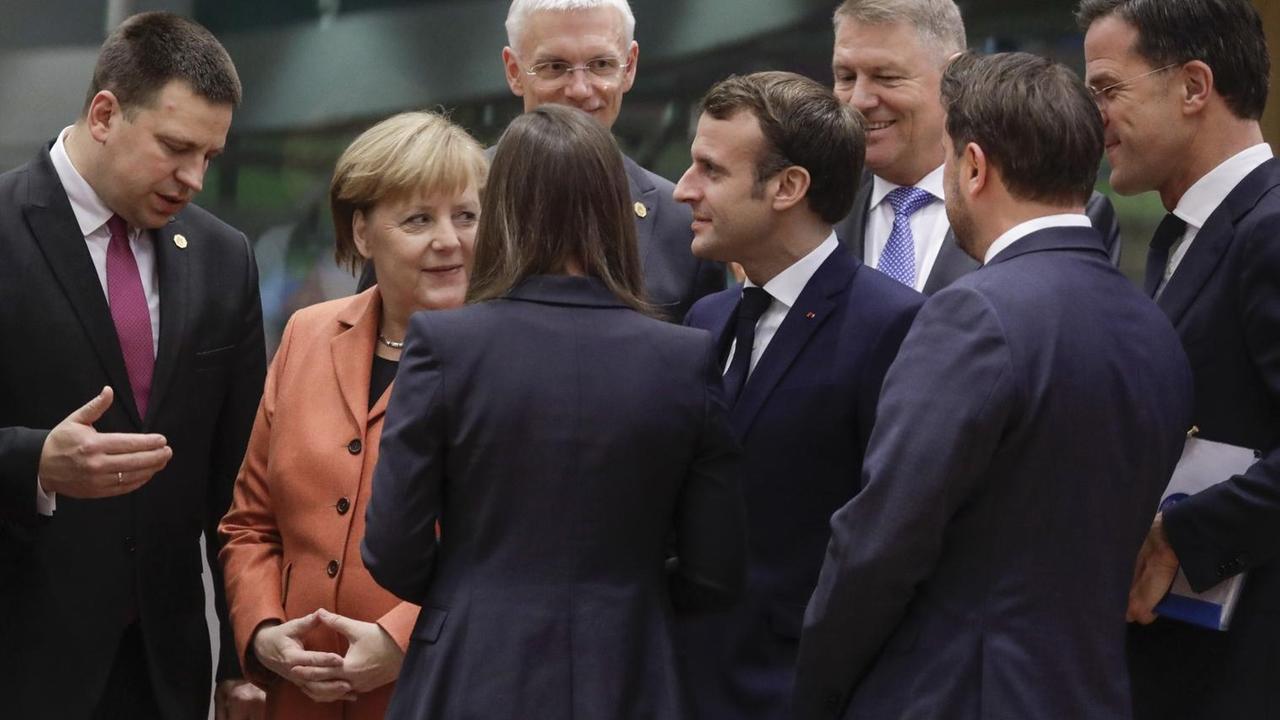 Angela Merkel, Emmanuel Macron und Mark Rutte am 12. Dezember 2019 in Brüssel. Angela Merkel, Emmanuel Macron und Mark Rutte am 12. Dezember 2019 in Brüssel.