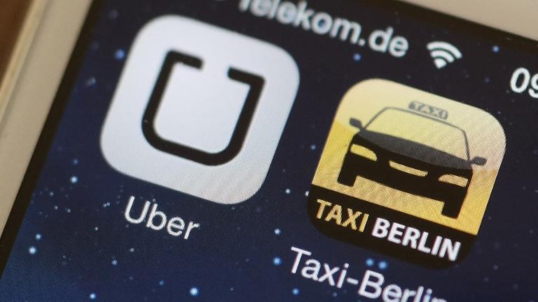 Die Handy-Apps "Uber" und "Taxi Berlin" sind am 11.06.2014 auf einem Smartphone in Berlin zu sehen. Die Handy-Apps "Uber" und "Taxi Berlin" sind am 11.06.2014 auf einem Smartphone in Berlin zu sehen.