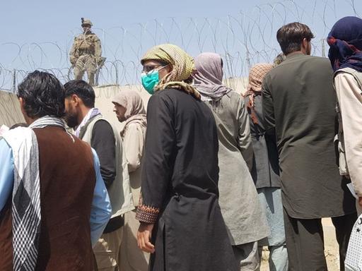 KABUL, AFGHANISTAN - AUGUST 23: People who want to flee the country continue to wait around Hamid Karzai International Airport in Kabul, Afghanistan on August 23, 2021. Sayed Khodaiberdi Sadat / Anadolu Agency