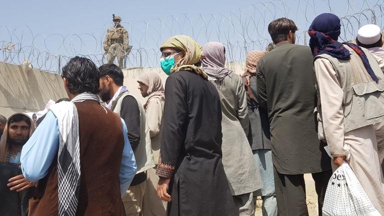KABUL, AFGHANISTAN - AUGUST 23: People who want to flee the country continue to wait around Hamid Karzai International Airport in Kabul, Afghanistan on August 23, 2021. Sayed Khodaiberdi Sadat / Anadolu Agency KABUL, AFGHANISTAN - AUGUST 23: People who want to flee the country continue to wait around Hamid Karzai International Airport in Kabul, Afghanistan on August 23, 2021. Sayed Khodaiberdi Sadat / Anadolu Agency