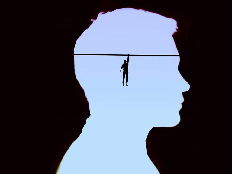 Eine Illustration zeigt im Kopf eines Mannes einen Mensch, der sich an ein Seil klammert.