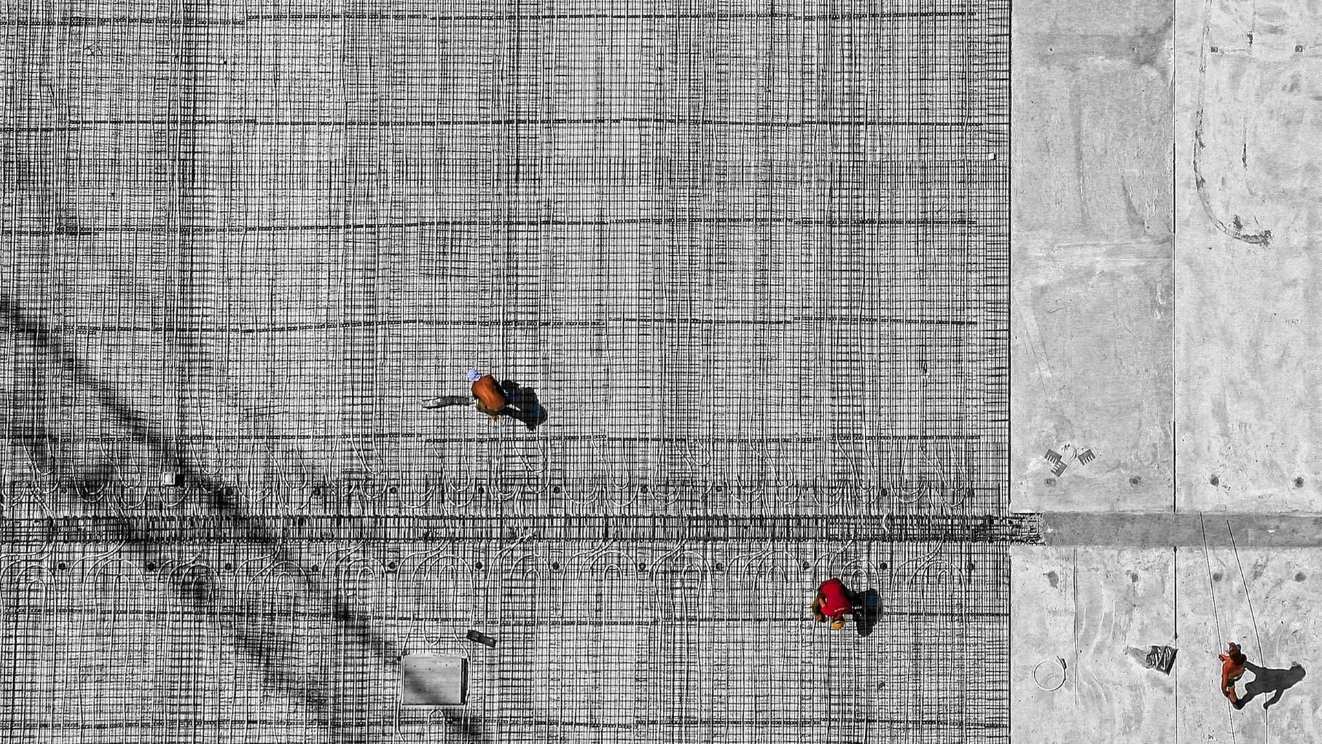 Arbeiter auf einer Baustelle. Arbeiter auf einer Baustelle.