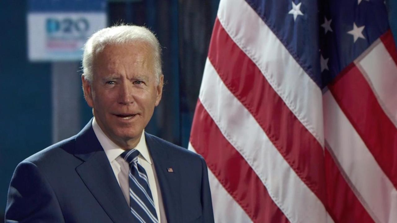 Präsidentschaftskandidat Joe Biden vor der US-amerikanischen Flagge Präsidentschaftskandidat Joe Biden vor der US-amerikanischen Flagge