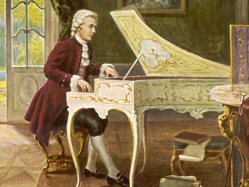 Eine historische Postkarte zeigt Wolfgang Amadeus Mozart am Cembalo