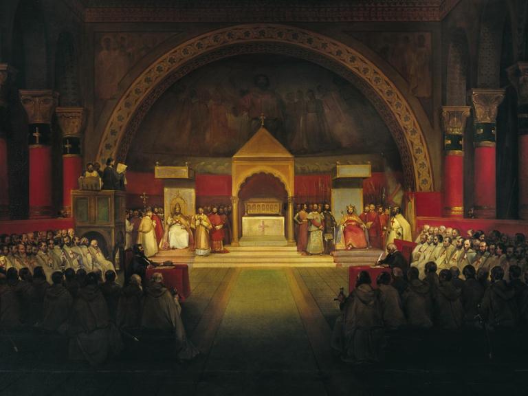 Gemälde der Kapitelversammlung derTempler. Ein sakraler Raum ist gefüllt mit Menschen. Auf dem Altar stehen verschiedene Personen in Ordenskleidung.