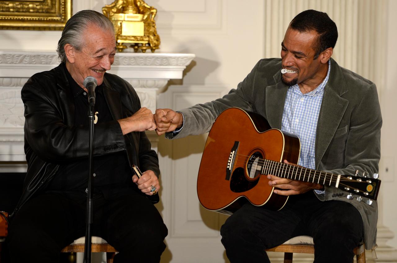 US recording artists Charlie Musselwhite (L) and Ben Harper (R) fist bump after performing during an interactive student workshop Event, 2013