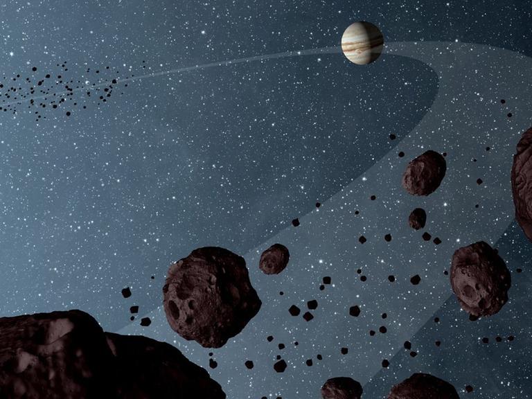 Eine NASA-Illustration zeigt die sogenannten "Trojan asteroids", die auf der Umlaufbahn des Jupiters in derselben Richtung kreisen. Ein kleiner Asteroid kreuzt als "kosmischer Geisterfahrer" seit mindestens einer Million Jahren die Bahn des Riesenplaneten.