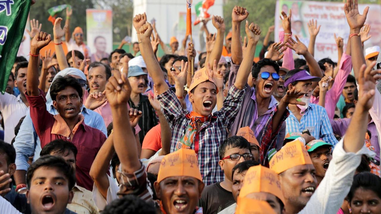epa05263973 Bharatiya Janata Party (BJP) activists react as Indian Prime Minister Narendra Modi (unseen) delivers speech during an election campaign ahead of Assembly election in Calcutta, eastern India, 17 April 2016. Thousands of BJP party activists and their leaders gathered during a campaign. It has been decided to conduct the West Bengal Elections 2016 in six phases, started on 04 April. EPA/PIYAL ADHIKARY | epa05263973 Bharatiya Janata Party (BJP) activists react as Indian Prime Minister Narendra Modi (unseen) delivers speech during an election campaign ahead of Assembly election in Calcutta, eastern India, 17 April 2016. Thousands of BJP party activists and their leaders gathered during a campaign. It has been decided to conduct the West Bengal Elections 2016 in six phases, started on 04 April. EPA/PIYAL ADHIKARY |