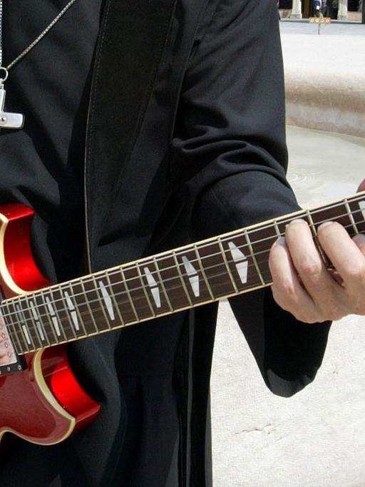 Ein Primas mit Gitarre