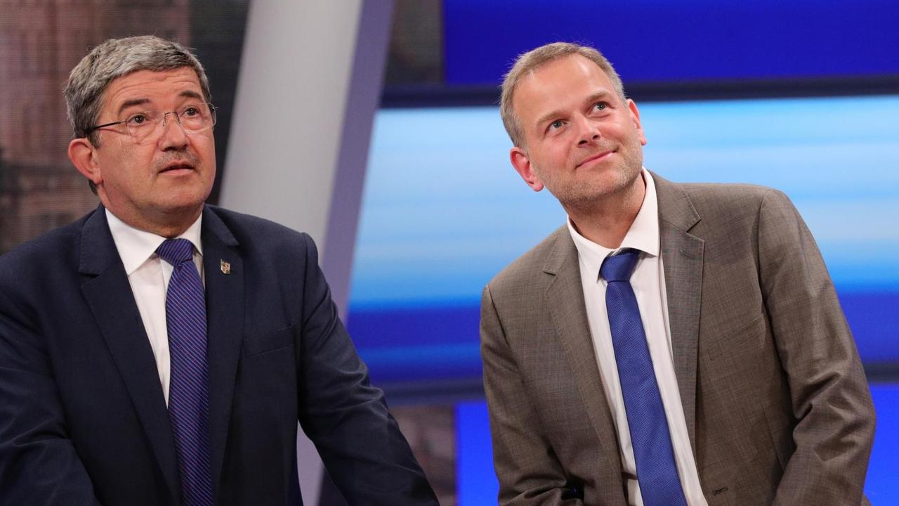 Der Spitzenkandidat der Partei Alternative für Deutschland (AfD), Leif-Erik Holm (r) und der Spitzenkandidat der CDU, Lorenz Caffier.