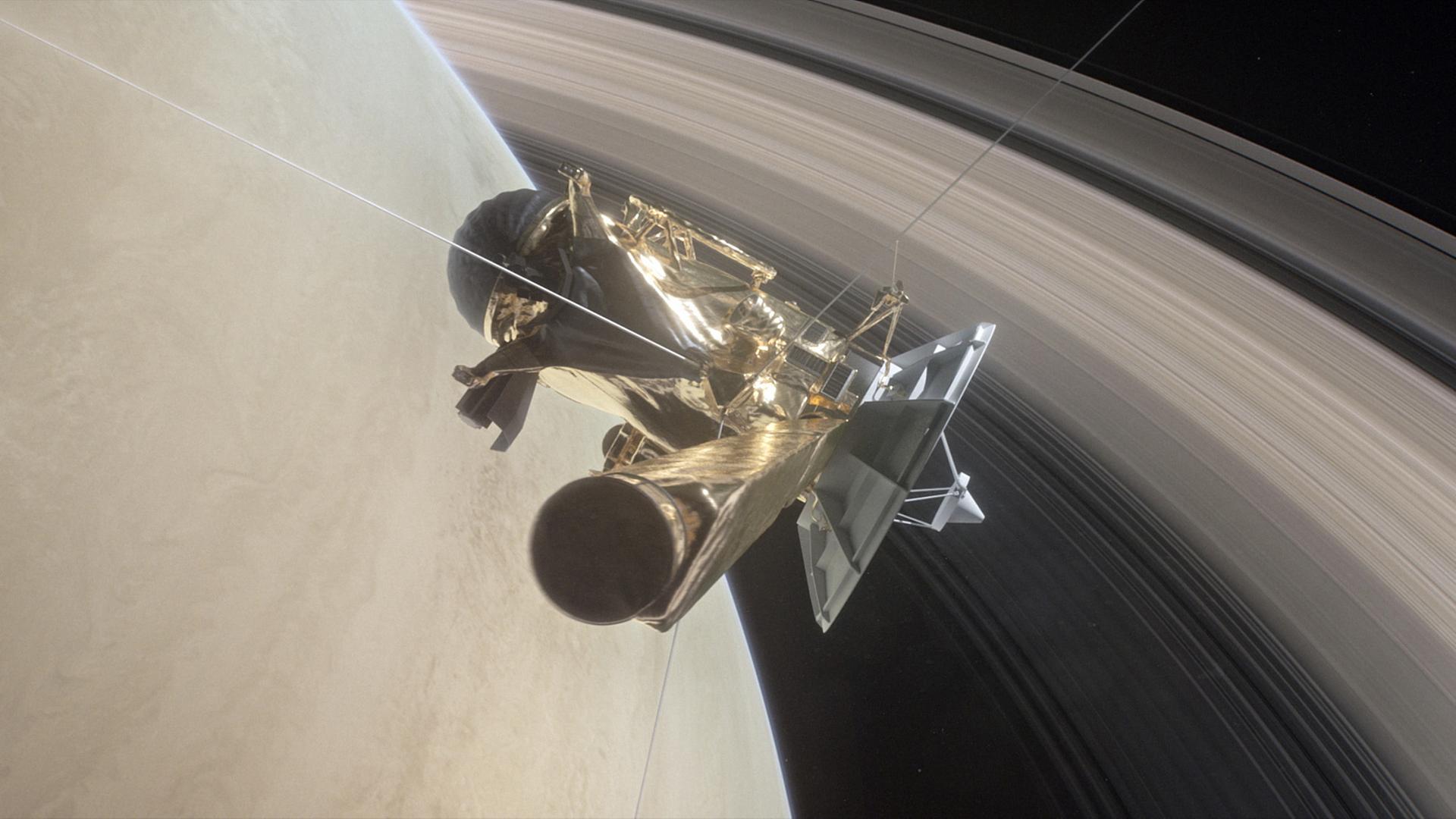 Die von der NASA am 25.04.2017 veröffentlichte Illustration zeigt, wie die Raumsonde «Cassini» zwischen dem Planet Saturn und dessen inneren Ringen kreist. Die von der NASA am 25.04.2017 veröffentlichte Illustration zeigt, wie die Raumsonde «Cassini» zwischen dem Planet Saturn und dessen inneren Ringen kreist.