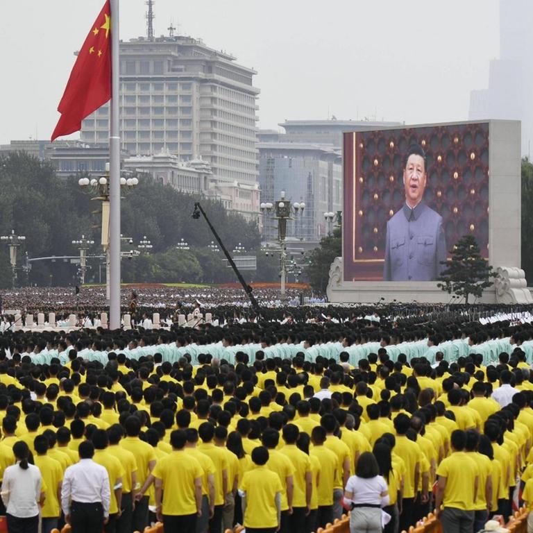  100th founding anniversary of Chinese Communist Party The Chinese national flag is raised and President Xi Jinping is seen on the big screen during an event to celebrate the 100th anniversary of the founding of the Communist Party on July 1, 2021, at Tiananmen Square in Beijing. PUBLICATIONxINxGERxSUIxAUTxHUNxONLY