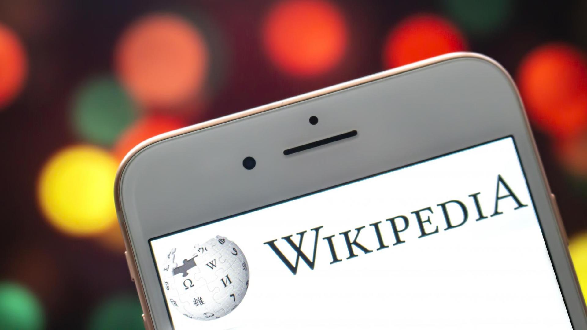 An iPhone Plus with a Wikipedia logo on the screen. An iPhone Plus with a Wikipedia logo on the screen.