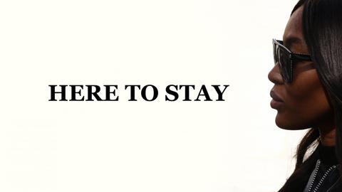 Naomi Campbell im Profil, daneben die Worte "Here to stay".