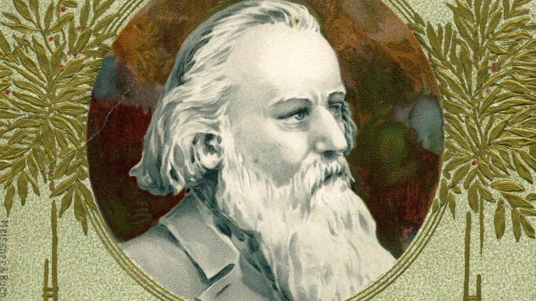 Ausschnitt einer Jugendstil-Postkarte, bei der ein Medaillon mit einem Brahms-Porträt von zwei Bäumchen umgeben ist. Ausschnitt einer Jugendstil-Postkarte, bei der ein Medaillon mit einem Brahms-Porträt von zwei Bäumchen umgeben ist.
