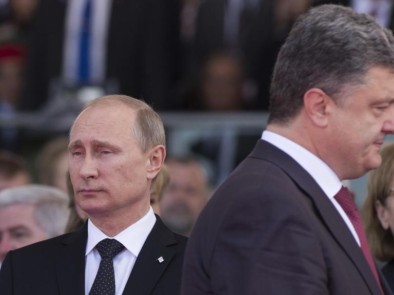  Russlands Präsident Wladimir Putin und der ukrainische Präsident Petro Poroschenko bei den Feiern zum 70. Jahrestag der Landung der Alliierten in der Normandie. 