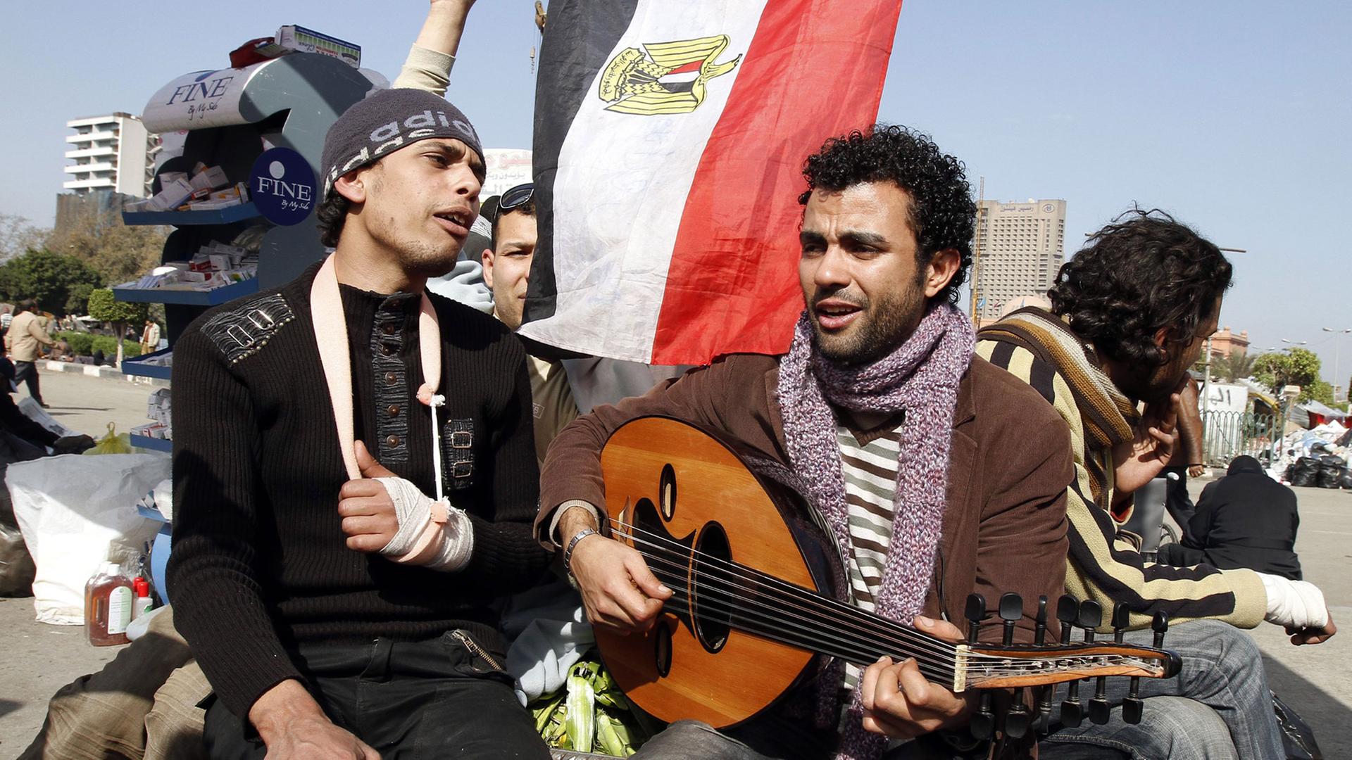 Egyptian demonstrators sing anti-Mubarak songs at Cairo's Tahrir square on February 6, 2011 on the 13th day of protests calling for the ouster of President Hosni Mubarak.