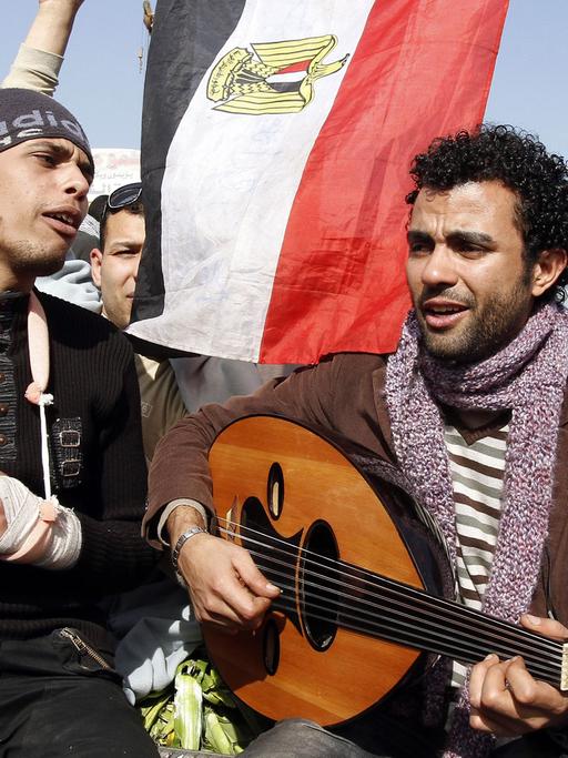 Egyptian demonstrators sing anti-Mubarak songs at Cairo's Tahrir square on February 6, 2011 on the 13th day of protests calling for the ouster of President Hosni Mubarak.