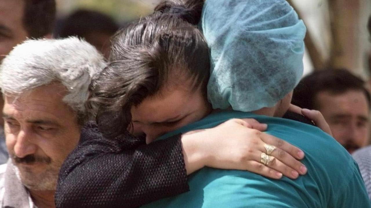 : Sena Bulte (C-L) an earthquake survivor is hugged by a relative 21 August 1999 in Izmit (over 100 kilometers east of Istanbul). Bulte was taken out of the rubbles of her house yesterday. The death toll of the quake stands over 12.000 dead and 33.500 wounded according to figures released today by the Turkish government crisis center. (ELECTRONIC IMAGE) dpa | : Sena Bulte (C-L) an earthquake survivor is hugged by a relative 21 August 1999 in Izmit (over 100 kilometers east of Istanbul). Bulte was taken out of the rubbles of her house yesterday. The death toll of the quake stands over 12.000 dead and 33.500 wounded according to figures released today by the Turkish government crisis center. (ELECTRONIC IMAGE) dpa |