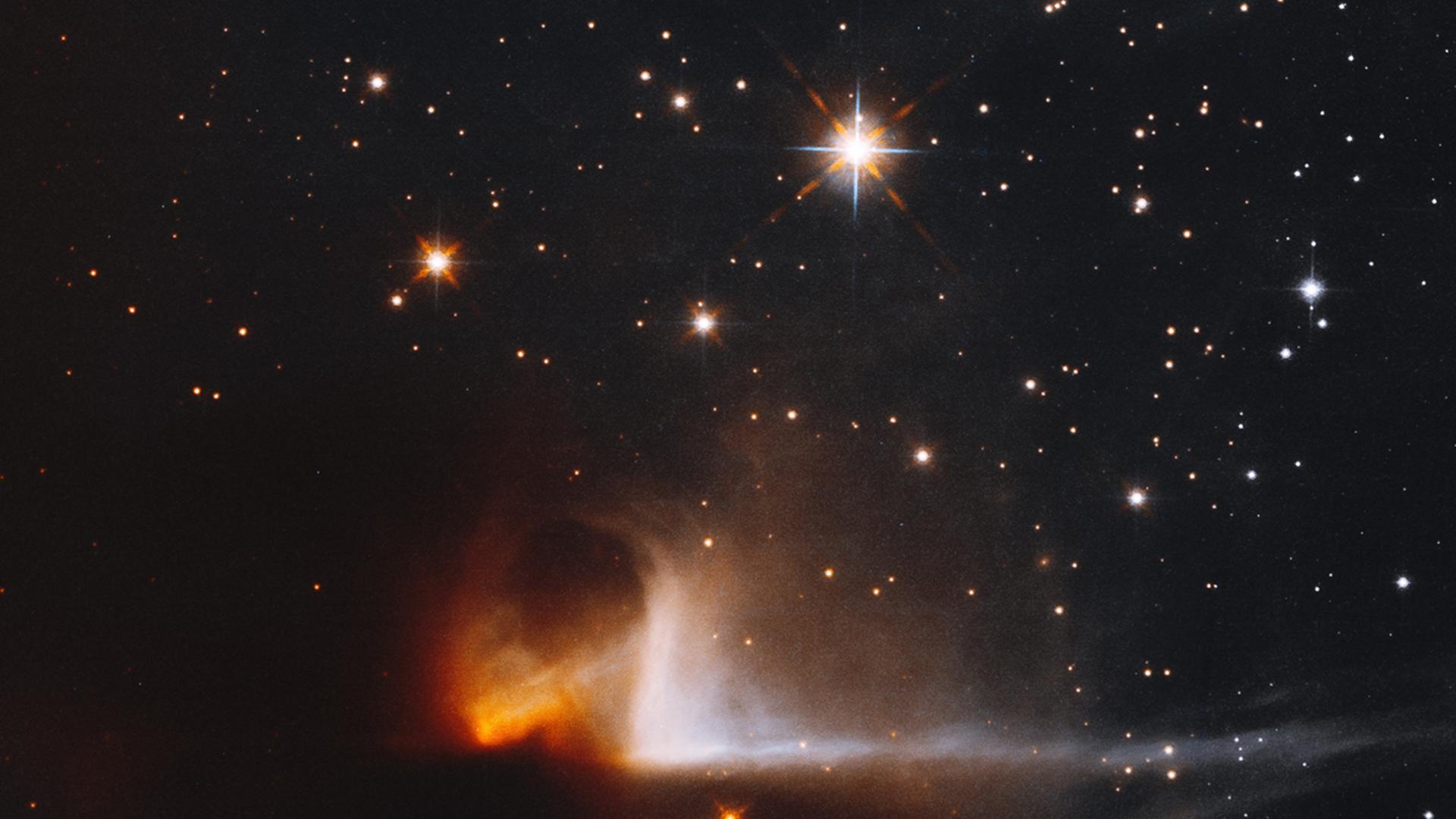 Im Infrarotbereich zeigt sich das Licht der ersten Sterne im Staub der Dunkelwolke