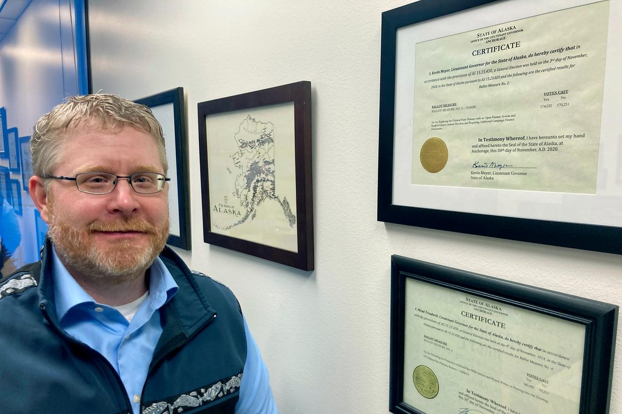 Attorney Scott Kendall stands next to the State of Alaska certificate for the election reforms he helped author in a successful ballot initiative in Anchorage, Alaska, on Jan. 21, 2022. Alaska elections will be held for the first time this year under a voter-backed system that scraps party primaries and sends the top four vote-getters regardless of party to the general election, where ranked choice voting will be used to determine a winner. No other state conducts its elections with that same combination. Attorney Scott Kendall stands next to the State of Alaska certificate for the election reforms he helped author in a successful ballot initiative in Anchorage, Alaska, on Jan. 21, 2022. Alaska elections will be held for the first time this year under a voter-backed system that scraps party primaries and sends the top four vote-getters regardless of party to the general election, where ranked choice voting will be used to determine a winner. No other state conducts its elections with that same combination.