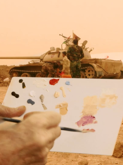 Ein Künstler malt Panzer in Mosul: Werk des Künstlers Francis Alys der "Antiwarcoalition"
