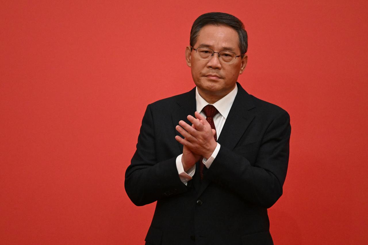 Der chinesische Politiker Li Qiang von der Kommunistischen Partei applaudiert. Der chinesische Politiker Li Qiang von der Kommunistischen Partei applaudiert.