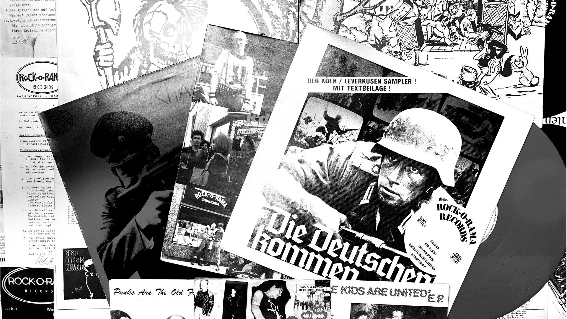 Eine Seite aus dem Buch "Rock-O-Rama. Die Deutschen kommen" von Björn Fischer zeigt eine Collage mit Plattencovern des Labels. Im Zentrum das, das zum Untertitel des Buches wurde. Eine Seite aus dem Buch "Rock-O-Rama. Die Deutschen kommen" von Björn Fischer zeigt eine Collage mit Plattencovern des Labels. Im Zentrum das, das zum Untertitel des Buches wurde.