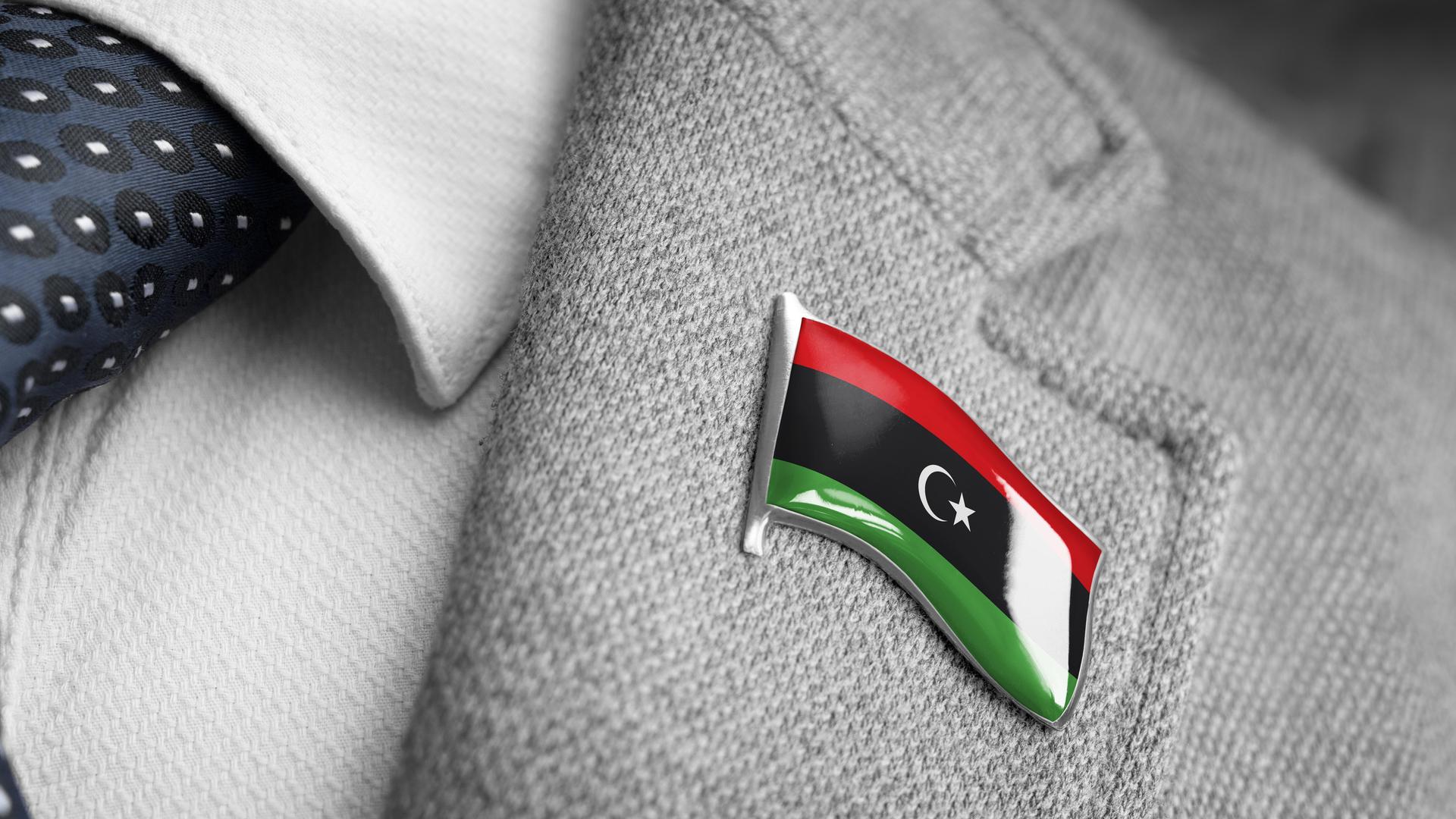 Metal badge with the flag of Libya on a suit lapel