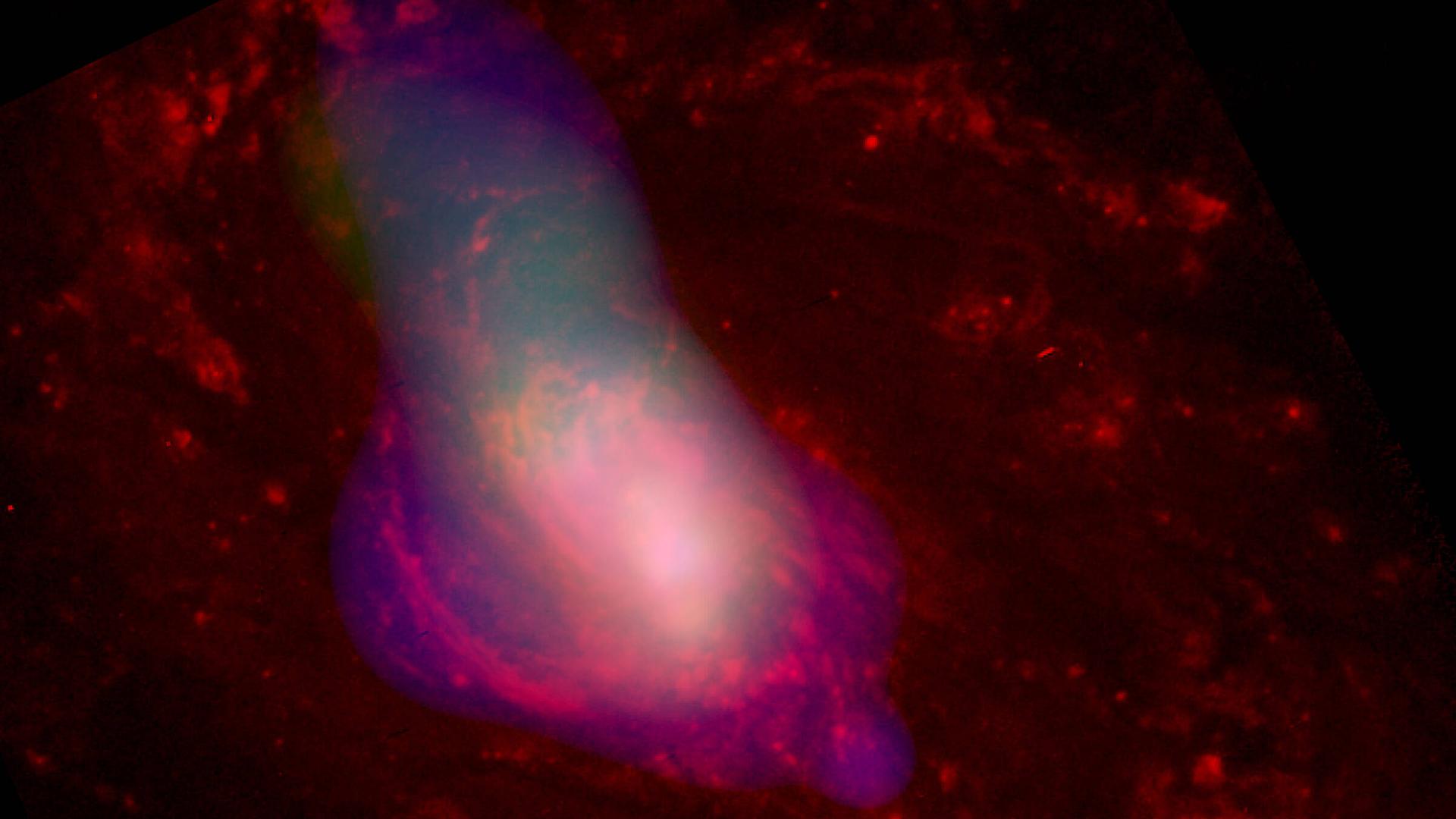 Ein 2003 vom Chandra-Teleskop aufgenommenes Bild zeigt heißes Gas, das mit einer durchschnittlichen Geschwindigkeit von etwa einer Million Meilen pro Stunde von einem zentralen supermassereichen schwarzen Loch weggeblasen wird.