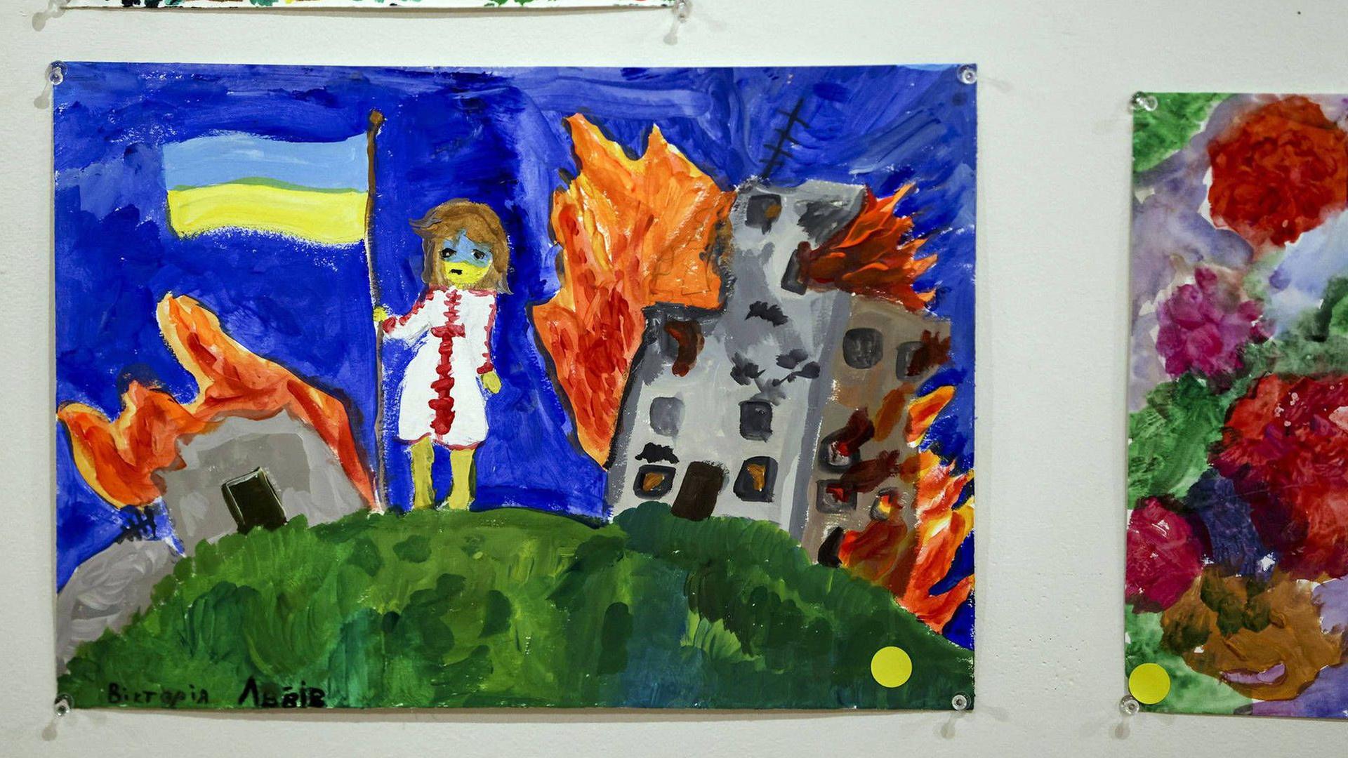 Ein Kinderbild zeigt ein von Krieg zerstörtes Haus.