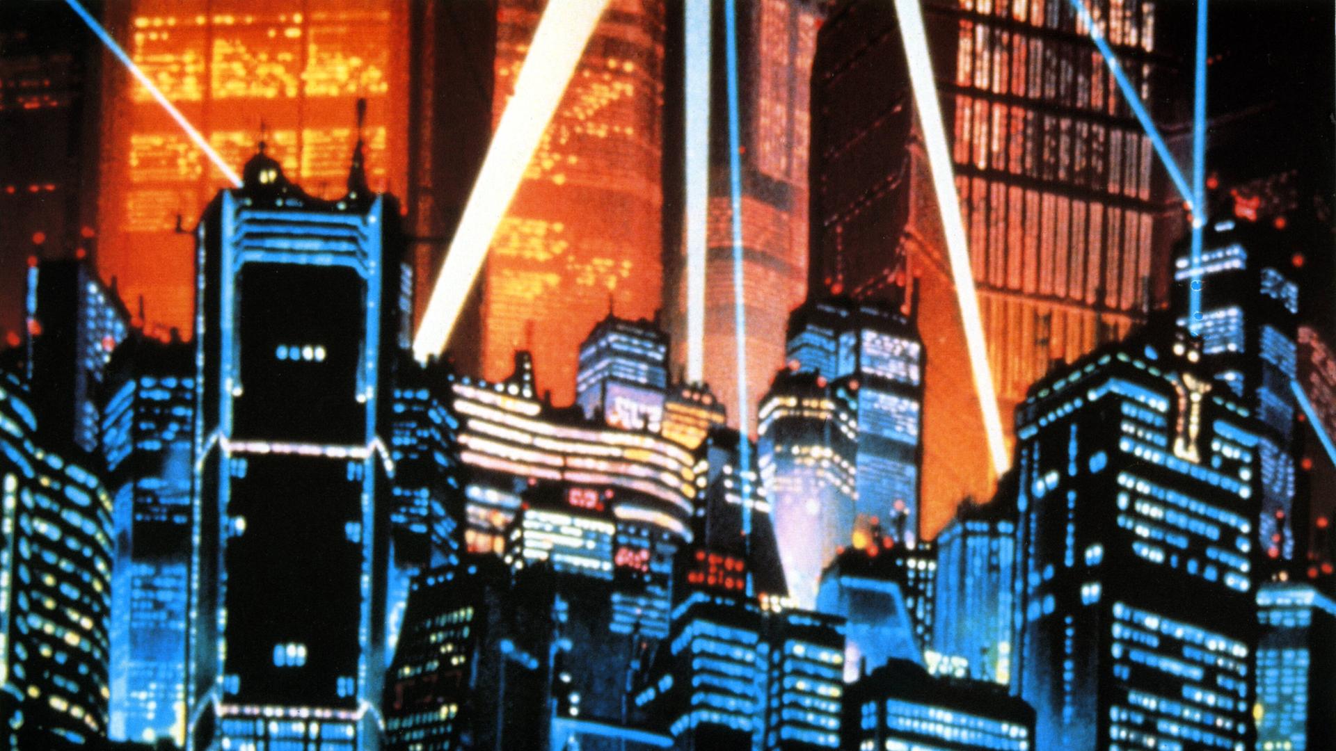 Eine Aufnahme aus dem Anime-Film Akria aus dem Jahr 1988. Es ist die von Scheinwerfern angeleuchtete Skyline der Stadt Neo-Tokyo mit vielen Hochäusern. Eine Aufnahme aus dem Anime-Film Akria aus dem Jahr 1988. Es ist die von Scheinwerfern angeleuchtete Skyline der Stadt Neo-Tokyo mit vielen Hochäusern.