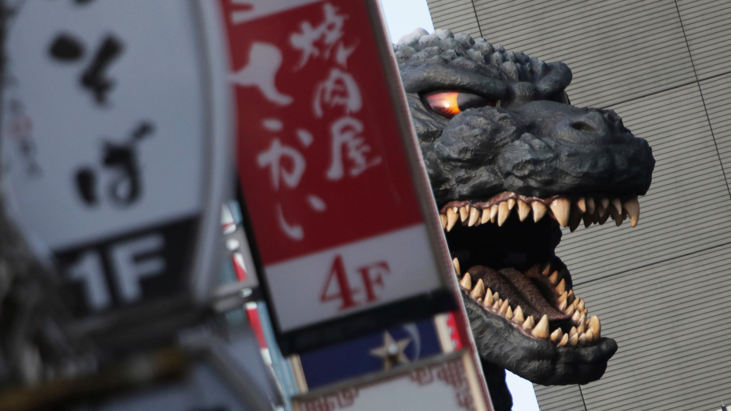 Godzilla taucht an seinem 60. Geburtstag hinter dem Shinjuku-Toho-Gebäu...</p>

                        <a href=
