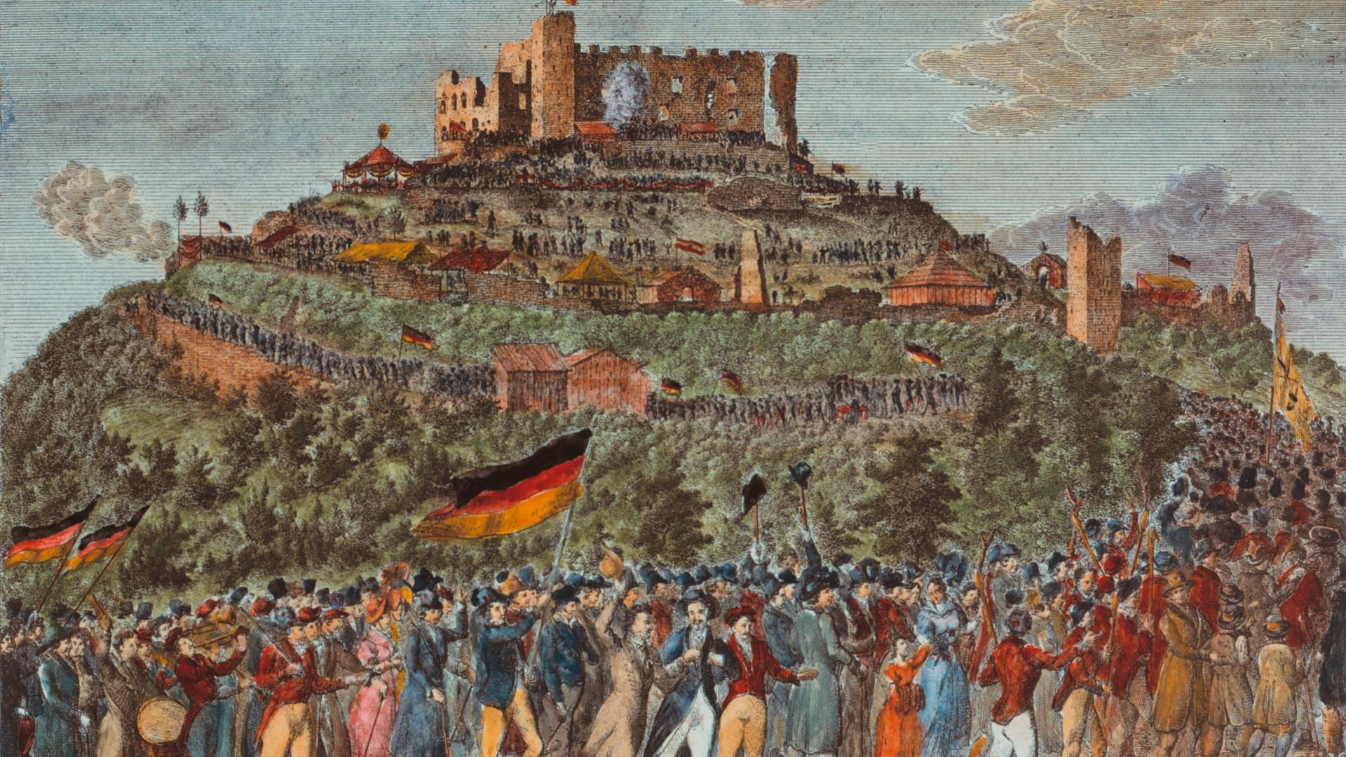 Das Bild aus dem Jahr 1832 zeigt eine Panorama-Perspektive auf das Schloss Hambach mit einem langen Menschenzug, der darauf zuhält. Die Leute schwenken Fahnen in den Farben Schwarz-Rot-Gold. Das Bild aus dem Jahr 1832 zeigt eine Panorama-Perspektive auf das Schloss Hambach mit einem langen Menschenzug, der darauf zuhält. Die Leute schwenken Fahnen in den Farben Schwarz-Rot-Gold.