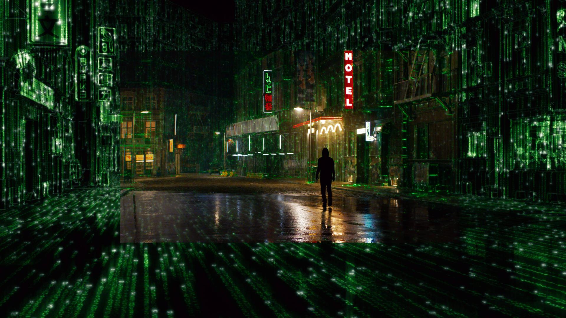 Filmszene aus Matrix 4 Resurrections von Lana Wachowski mit Keanu Reeves. Zu sehen ist eine dystopisch anumtende Stadt in nächtlicher Beleuchtung.