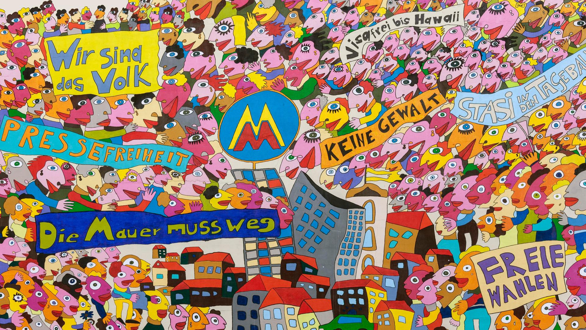 Sehr viele bunte Köpfe von fröhlichen Figuren, dazu Transparente mit Parolen "Wir sind das Volk", "Visafrei nach Hawaii" und "Die Mauer muss weg" auf einer Hausfassade Sehr viele bunte Köpfe von fröhlichen Figuren, dazu Transparente mit Parolen "Wir sind das Volk", "Visafrei nach Hawaii" und "Die Mauer muss weg" auf einer Hausfassade