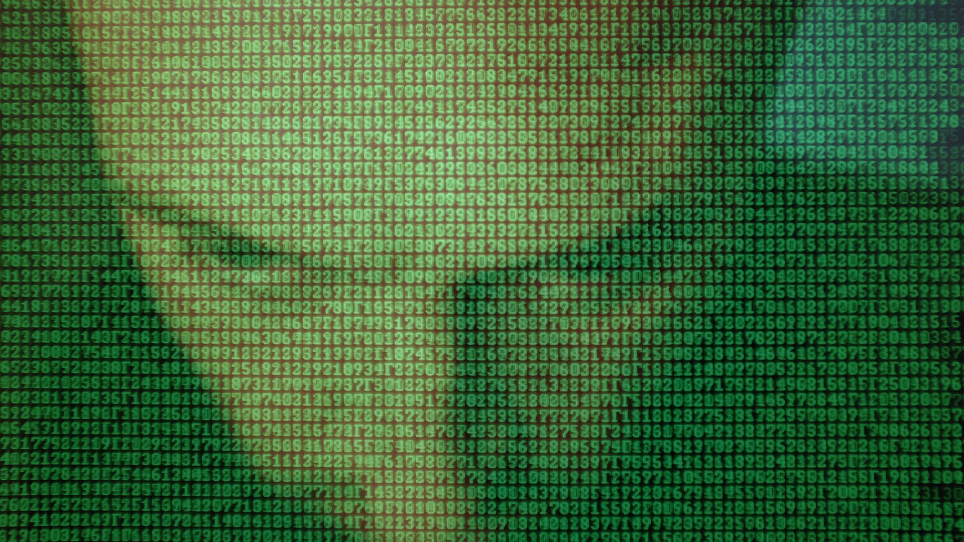 Der gesenkte Kopf eines Mannes hinter einer Binärcode-Wand. Der gesenkte Kopf eines Mannes hinter einer Binärcode-Wand.